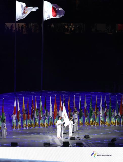 (260919) -- NAGOYA, Sept. 19, 2026 (Xinhua) -- Akamatsu Ryoichi (front L) and Tanaka Yuri (front R) take the oath during the opening ceremony of the 20th Asian Games Aichi-Nagoya 2026 in Nagoya, Japan, Sept. 19, 2026. (Xinhua/Wang Fei)