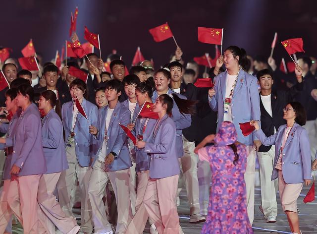 (260919) -- NAGOYA, Sept. 19, 2026 (Xinhua) -- The delegation of China parades into the stadium during the opening ceremony of the 20th Asian Games Aichi-Nagoya 2026 in Nagoya, Japan, Sept. 19, 2026. (Xinhua/Long Lei)