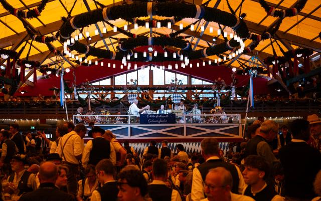 (260919) -- MUNICH, Sept. 19, 2026 (Xinhua) -- A band performs at the Oktoberfest in Munich, Germany, Sept. 19, 2026. The 191st Oktoberfest, one of the largest folk festivals in Germany, opened on Saturday in Munich, with mayor Dominik Krause tapping the first barrel of beer as a tradition. This year's festival will last until Oct. 4. (Xinhua/Zhang Haofu)