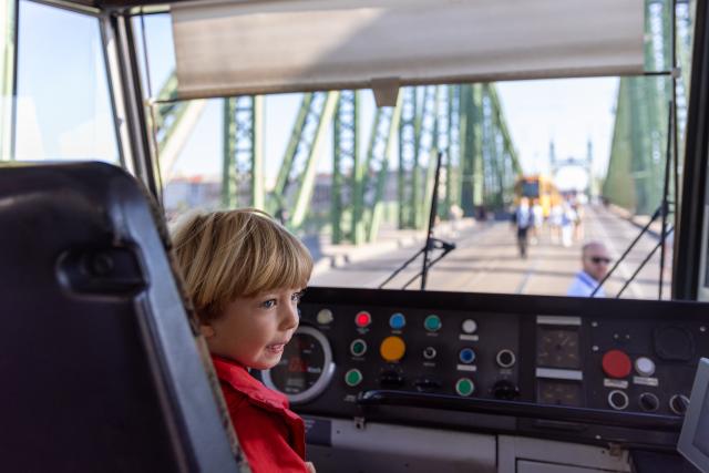 (260919) -- BUDAPEST, Sept. 19, 2026 (Xinhua) -- A child visits the interior of a tram during a car-free weekend event in Budapest, Hungary, on Sept. 19, 2026. Budapest is holding a car-free weekend on Sept. 19-20 as part of European Mobility Week, promoting environmentally friendly and sustainable travel through public transport vehicle displays, cycling activities and family events. (Xinhua/Hu Zhixuan)