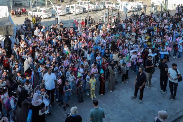 (260919) -- GAZA, Sept. 19, 2026 (Xinhua) -- Palestinian students attend first day of the new school year at an UNRWA school, in Nuseirat, in the central Gaza Strip, on Sept. 19, 2026. TO GO WITH "Feature: Gaza reopens schools for in-person learning after 3-year hiatus" (Photo by Rizek Abdeljawad/Xinhua)