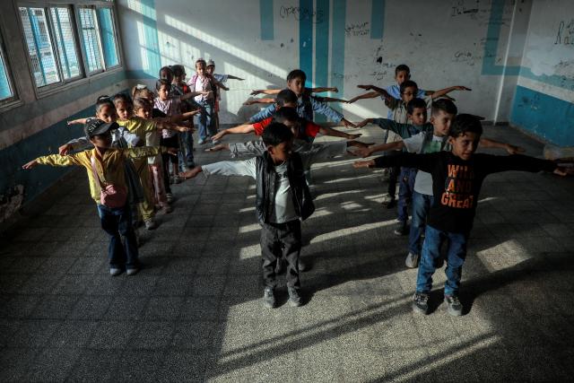 (260919) -- GAZA, Sept. 19, 2026 (Xinhua) -- Palestinian students attend first day of the new school year at an UNRWA school, in Nuseirat, in the central Gaza Strip, on Sept. 19, 2026. TO GO WITH "Feature: Gaza reopens schools for in-person learning after 3-year hiatus" (Photo by Rizek Abdeljawad/Xinhua)
