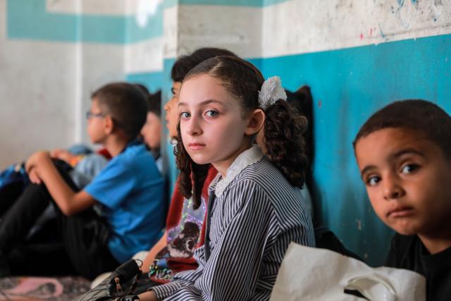 (260919) -- GAZA, Sept. 19, 2026 (Xinhua) -- Palestinian students attend first day of the new school year at an UNRWA school, in Nuseirat, in the central Gaza Strip, on Sept. 19, 2026. TO GO WITH "Feature: Gaza reopens schools for in-person learning after 3-year hiatus" (Photo by Rizek Abdeljawad/Xinhua)