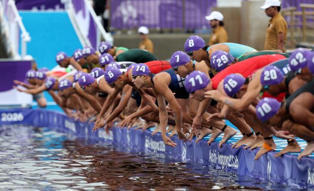 (260920) -- NAGOYA, Sept. 20, 2026 (Xinhua) -- Athletes start during the men's individual triathlon final at the 20th Asian Games Aichi-Nagoya 2026 in Gamagori City of Aichi prefecture, Japan, Sept. 20, 2026. (Xinhua/Deng Hua)