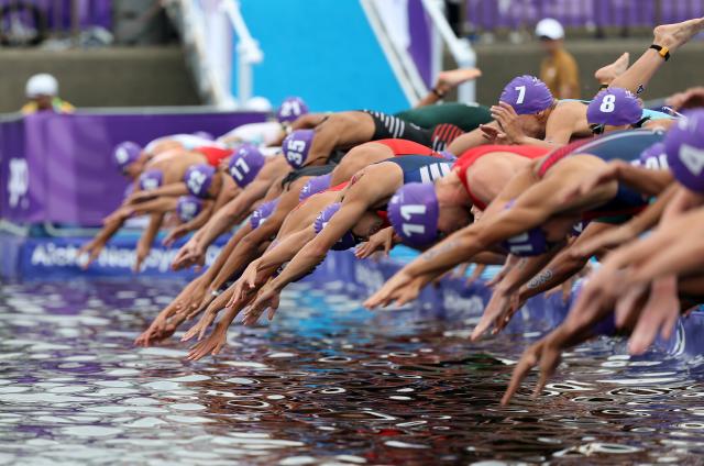 (260920) -- NAGOYA, Sept. 20, 2026 (Xinhua) -- Athletes start during the men's individual triathlon final at the 20th Asian Games Aichi-Nagoya 2026 in Gamagori City of Aichi prefecture, Japan, Sept. 20, 2026. (Xinhua/Deng Hua)