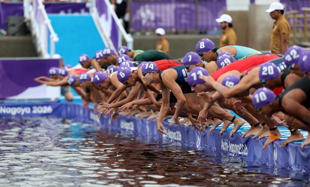 (260920) -- NAGOYA, Sept. 20, 2026 (Xinhua) -- Athletes start during the men's individual triathlon final at the 20th Asian Games Aichi-Nagoya 2026 in Gamagori City of Aichi prefecture, Japan, Sept. 20, 2026. (Xinhua/Deng Hua)