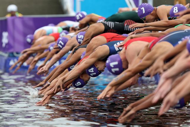 (260920) -- NAGOYA, Sept. 20, 2026 (Xinhua) -- Athletes start during the men's individual triathlon final at the 20th Asian Games Aichi-Nagoya 2026 in Gamagori City of Aichi prefecture, Japan, Sept. 20, 2026. (Xinhua/Deng Hua)