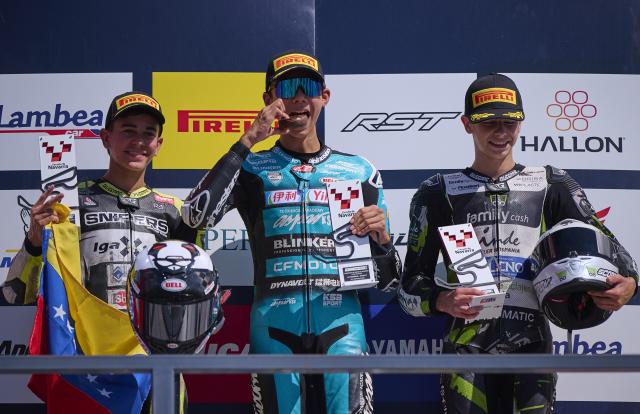 (260920) -- NAVARRA, Sept. 20, 2026 (Xinhua) -- (L to R)Igax Team Snipers' rider Diego Gonzalez, CFMOTO Aspar Sun's rider Shengbo of China and Family Racing Team's rider Fermin Valero pose at the podium after the race 1 of the ESBK Talent category at the 2026 Spanish Superbike Championship Navarra in Navarra, Spain, Sept. 19, 2026. (Photo by Pablo Morano/Xinhua)
