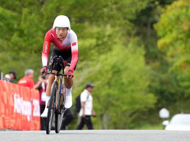 (260920) -- NAGOYA, Sept. 20, 2026 (Xinhua) -- Zhang Hao of China competes during the women's individual time trial of cycling road at the 20th Asian Games Aichi-Nagoya 2026 in Shinshiro of Aichi Prefecture, Japan, Sept. 20, 2026. (Xinhua/Lui Siu Wai)