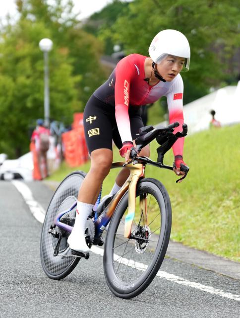 (260920) -- NAGOYA, Sept. 20, 2026 (Xinhua) -- Zhang Hao of China competes during the women's individual time trial of cycling road at the 20th Asian Games Aichi-Nagoya 2026 in Shinshiro of Aichi Prefecture, Japan, Sept. 20, 2026. (Xinhua/Lui Siu Wai)