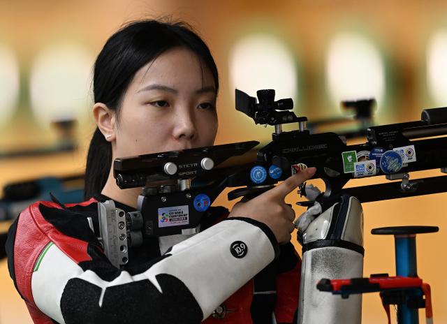 (260920) -- NAGOYA, Sept. 20, 2026 (Xinhua) -- Wang Zifei of team China reacts during the 10m air rifle women team final of shooting at the 20th Asian Games Aichi-Nagoya 2026 in Toyota of Aichi Prefecture, Japan, Sept. 20, 2026. (Xinhua/Liu Lei)