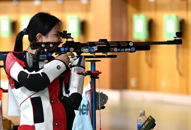 (260920) -- NAGOYA, Sept. 20, 2026 (Xinhua) -- Wang Zifei of team China competes during the 10m air rifle women team final of shooting at the 20th Asian Games Aichi-Nagoya 2026 in Toyota of Aichi Prefecture, Japan, Sept. 20, 2026. (Xinhua/Liu Lei)