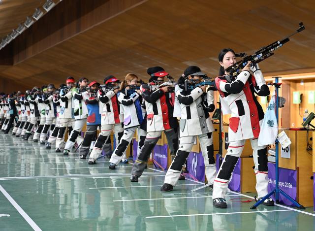 (260920) -- NAGOYA, Sept. 20, 2026 (Xinhua) -- Wang Zifei (1st R) of team China reacts during the 10m air rifle women team final of shooting at the 20th Asian Games Aichi-Nagoya 2026 in Toyota of Aichi Prefecture, Japan, Sept. 20, 2026. (Xinhua/Liu Lei)