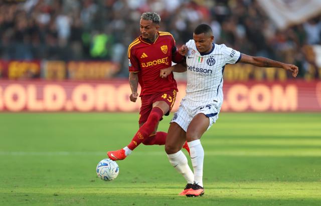 (260920) -- ROME, Sept. 20, 2026 (Xinhua) -- Roma's Wesley Vinicius Franca Lima (L) vies with Inter Milan's Manuel Akanji during a Serie A football match between Roma and Inter Milan in Rome, Italy, Sept. 19, 2026. (Xinhua/Wang Kaiyan)