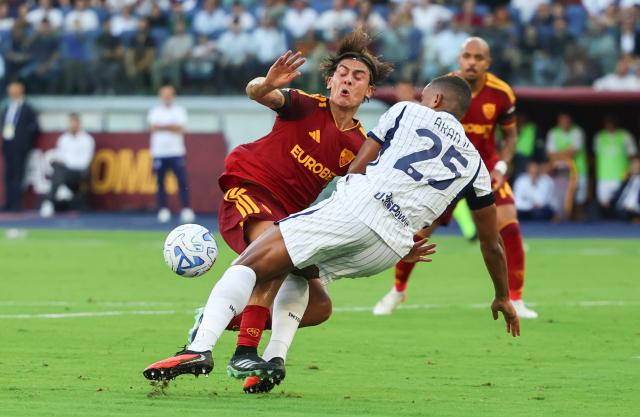 (260920) -- ROME, Sept. 20, 2026 (Xinhua) -- Roma's Paulo Dybala (L) vies with Inter Milan's Manuel Akanji during a Serie A football match between Roma and Inter Milan in Rome, Italy, Sept. 19, 2026. (Xinhua/Wang Kaiyan)