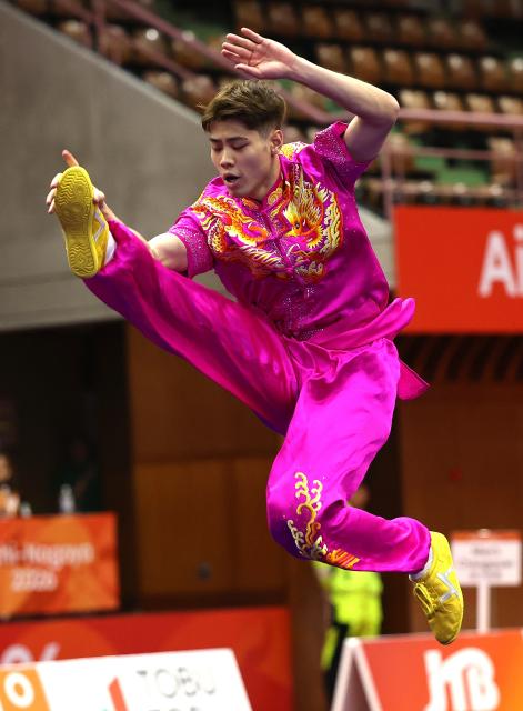 (260920) -- NAGOYA, Sept. 20, 2026 (Xinhua) -- Kuong Chi Hin of China's Macao competes during the Men's Changquan Final of Wushu at the 20th Asian Games Aichi-Nagoya 2026 in Nagoya of Aichi Prefecture, Japan, Sept. 20, 2026. (Xinhua/Wang Dongzhen)
