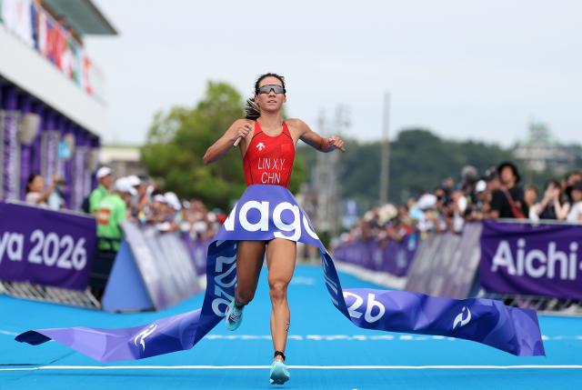 (260920) -- NAGOYA, Sept. 20, 2026 (Xinhua) -- Lin Xinyu of China crosses the finish line during the women's individual triathlon final at the 20th Asian Games Aichi-Nagoya 2026 in Gamagori City of Aichi Prefecture, Japan, Sept. 20, 2026. (Xinhua/Deng Hua)