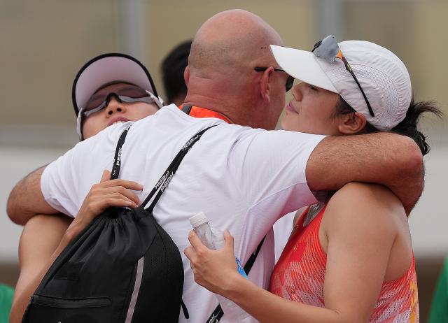 (260920) -- NAGOYA, Sept. 20, 2026 (Xinhua) -- Zhang Mingyu (L) and Wu Xiyao (R) of China celebrate after the women's individual final, laser run round of modern pentathlon at the 20th Asian Games Aichi-Nagoya 2026 in Anjo city of Aichi Prefecture, Japan, Sept. 20, 2026. (Xinhua/Zhou Mi)