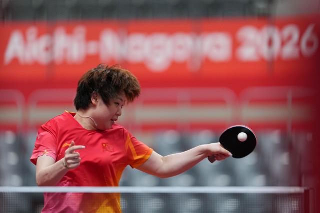 (260920) -- NAGOYA, Sept. 20, 2026 (Xinhua) -- Kuai Man of team China competes against Nabita Shrestha of team Nepal during the women's team Group A table tennis match between China and Nepal at the 20th Asian Games Aichi-Nagoya 2026 in Toyota, Japan, Sept. 20, 2026. (Xinhua/Cheong Kam Ka)