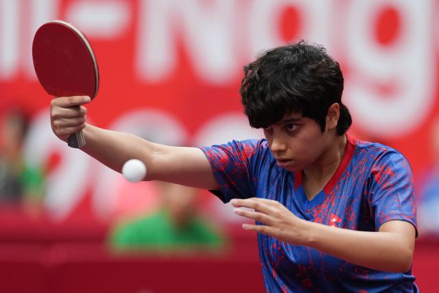 (260920) -- NAGOYA, Sept. 20, 2026 (Xinhua) -- Yonggi Poudel of team Nepal competes against Fan Shuhan of team China of team China during the women's team Group A table tennis match between China and Nepal at the 20th Asian Games Aichi-Nagoya 2026 in Toyota, Japan, Sept. 20, 2026. (Xinhua/Cheong Kam Ka)