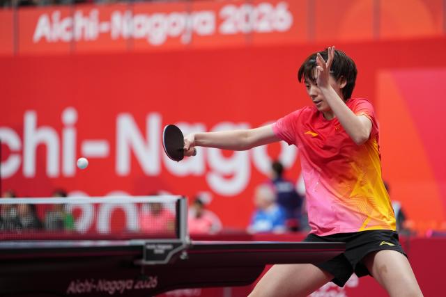 (260920) -- NAGOYA, Sept. 20, 2026 (Xinhua) -- Chen Yi of team China competes against Evana Thapa of team Nepal during the women's team Group A table tennis match between China and Nepal at the 20th Asian Games Aichi-Nagoya 2026 in Toyota, Japan, Sept. 20, 2026. (Xinhua/Cheong Kam Ka)