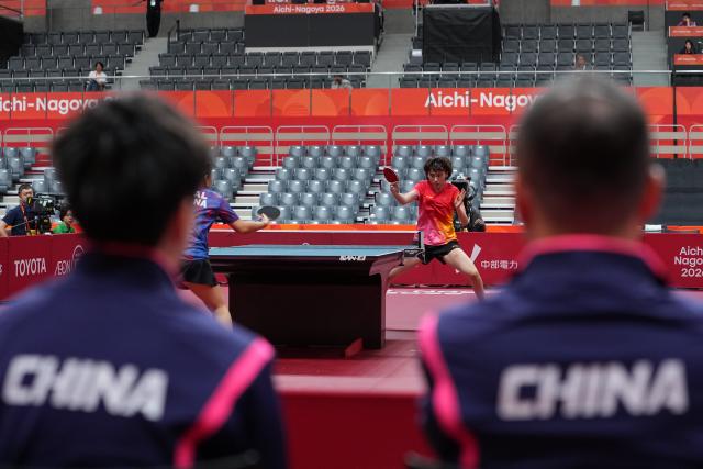 (260920) -- NAGOYA, Sept. 20, 2026 (Xinhua) -- Chen Yi of team China competes against Evana Thapa of team Nepal during the women's team Group A table tennis match between China and Nepal at the 20th Asian Games Aichi-Nagoya 2026 in Toyota, Japan, Sept. 20, 2026. (Xinhua/Cheong Kam Ka)