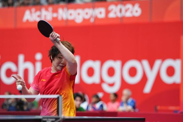 (260920) -- NAGOYA, Sept. 20, 2026 (Xinhua) -- Kuai Man of team China competes against Nabita Shrestha of team Nepal during the women's team Group A table tennis match between China and Nepal at the 20th Asian Games Aichi-Nagoya 2026 in Toyota, Japan, Sept. 20, 2026. (Xinhua/Cheong Kam Ka)