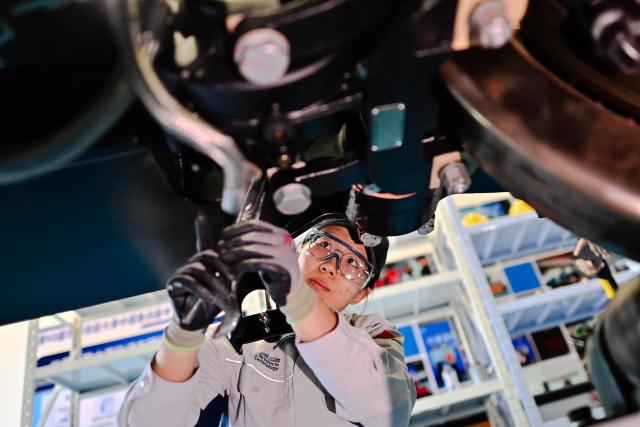 (260921) -- BEIJING, Sept. 21, 2026 (Xinhua) -- He Xiaoman conducts a training session at a training base of Changchun Digital Technology Vocational College in Changchun, northeast China's Jilin Province, Sept. 9, 2026. He Xiaoman, born in 2006, is a student from Changchun Digital Technology Vocational College. She is the only female competitor in the rail vehicle technology event at the upcoming 48th WorldSkills Competition. (Xinhua/Yan Linyun)