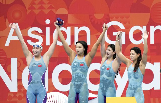 (260921) -- BEIJING, Sept. 21, 2026 (Xinhua) -- Wu Qingfeng, Cheng Yujie, Zhang Yufei and Yu Yiting (from L to R) of Team China celebrate after the women's 4x100m freestyle relay final of swimming at the 20th Asian Games Aichi-Nagoya 2026 in Tokyo, Japan, Sept. 20, 2026. (Photo by Wang Shen/Xinhua)