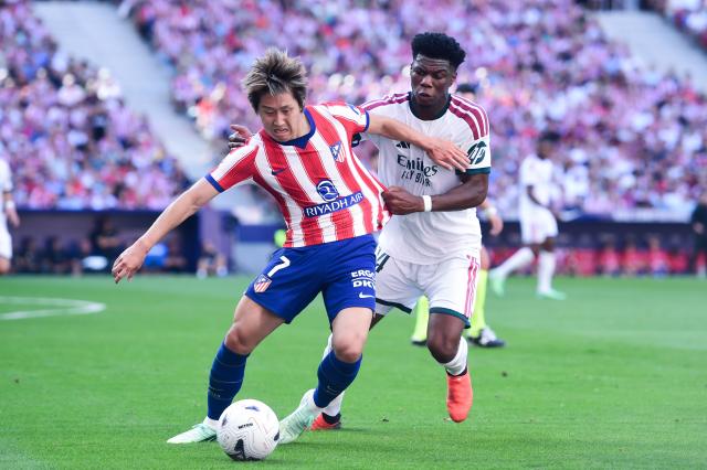 (260921) -- MADRID, Sept. 21, 2026 (Xinhua) -- Atletico de Madrid's Lee Kang-In (L) vies with Real Madrid's Tchouameni during a La Liga football match between Atletico de Madrid and Real Madrid at Riyadh Air Metropolitano stadium in Madrid, Spain, on Sept. 20, 2026. (Photo by Gustavo Valiente/Xinhua)