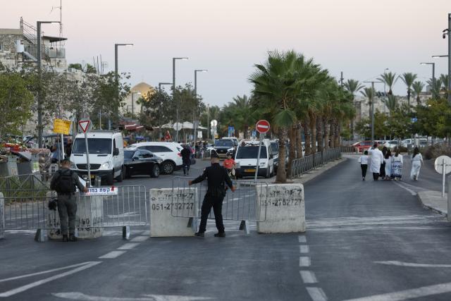 (260921) -- JERUSALEM, Sept. 21, 2026 (Xinhua) -- Police set up a temporary roadblock to restrict traffic ahead of Yom Kippur in Jerusalem on Sept. 20, 2026. Yom Kippur, or the "Day of Atonement," is a time for reflection and repentance for Jews. Jews traditionally fast on this day and hold intense services in synagogues through most of the day. The day begins on Sunday at dusk and ends on Monday at nightfall. (Photo by Jamal Awad/Xinhua)