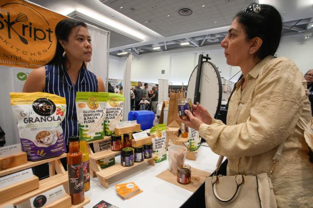 (260921) -- VANCOUVER, Sept. 21, 2026 (Xinhua) -- A visitor looks at gluten-free food products at the Gluten Free Expo in Vancouver, British Columbia, Canada, Sept. 20, 2026. The event featured gluten-free food and beverage products, sampling, shopping and educational presentations. (Photo by Liang Sen/Xinhua)