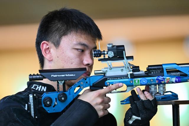 (260921) -- NAGOYA, Sept. 21, 2026 (Xinhua) -- Zhang Changhong of team China reacts during the 10m air rifle men team final of shooting at the 20th Asian Games Aichi-Nagoya 2026 in Toyota of Aichi Prefecture, Japan, Sept. 21, 2026. (Xinhua/Liu Lei)