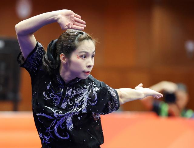 (260921) -- NAGOYA, Sept. 21, 2026 (Xinhua) -- Sou Cho Man of China's Macao competes during the Women's Changquan Final of Wushu at the 20th Asian Games Aichi-Nagoya 2026 in Nagoya of Aichi Prefecture, Japan, Sept. 21, 2026. (Xinhua/Long Lei)
