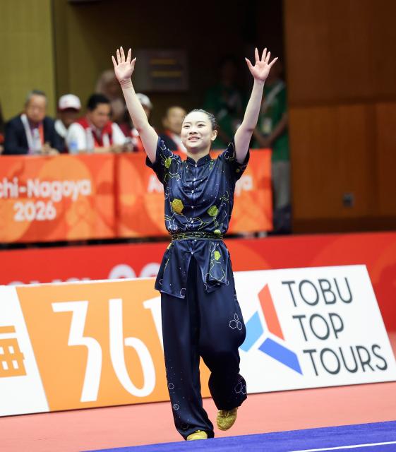 (260921) -- NAGOYA, Sept. 21, 2026 (Xinhua) -- Sham Hui Yu Lydia of China's Hong Kong celebrates after the Women's Changquan Final of Wushu at the 20th Asian Games Aichi-Nagoya 2026 in Nagoya of Aichi Prefecture, Japan, Sept. 21, 2026. (Xinhua/Long Lei)
