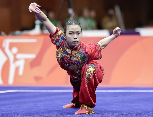 (260921) -- NAGOYA, Sept. 21, 2026 (Xinhua) -- Eugenia Diva Widodo of Indonesia competes during the Women's Changquan Final of Wushu at the 20th Asian Games Aichi-Nagoya 2026 in Nagoya of Aichi Prefecture, Japan, Sept. 21, 2026. (Xinhua/Long Lei)