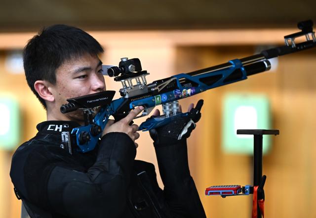 (260921) -- NAGOYA, Sept. 21, 2026 (Xinhua) -- Zhang Changhong of team China reacts during the 10m air rifle men team final of shooting at the 20th Asian Games Aichi-Nagoya 2026 in Toyota of Aichi Prefecture, Japan, Sept. 21, 2026. (Xinhua/Liu Lei)