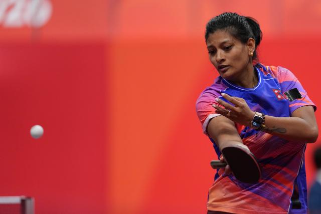 (260921) -- NAGOYA, Sept. 21, 2026 (Xinhua) -- Nabita Shrestha of team Nepal hits a return to Zhu Yu Ling of team China's Macao during the women's team Group A table tennis match between China's Macao and Nepal at the 20th Asian Games Aichi-Nagoya 2026 in Toyota, Japan, Sept. 21, 2026. (Xinhua/Cheong Kam Ka)