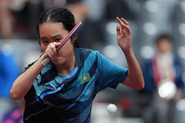 (260921) -- NAGOYA, Sept. 21, 2026 (Xinhua) -- Kuan Cheok Lam of team China's Macao hits a return to Nabita Shrestha of team Nepal during the women's team Group A table tennis match between China's Macao and Nepal at the 20th Asian Games Aichi-Nagoya 2026 in Toyota, Japan, Sept. 21, 2026. (Xinhua/Cheong Kam Ka)