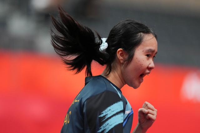 (260921) -- NAGOYA, Sept. 21, 2026 (Xinhua) -- Kuan Cheok Lam of team China's Macao reacts to Nabita Shrestha of team Nepal during the women's team Group A table tennis match between China's Macao and Nepal at the 20th Asian Games Aichi-Nagoya 2026 in Toyota, Japan, Sept. 21, 2026. (Xinhua/Cheong Kam Ka)