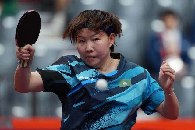 (260921) -- NAGOYA, Sept. 21, 2026 (Xinhua) -- Zhu Yu Ling of team China's Macao hits a return to Evana Thapa of team Nepal during the women's team Group A table tennis match between China's Macao and Nepal at the 20th Asian Games Aichi-Nagoya 2026 in Toyota, Japan, Sept. 21, 2026. (Xinhua/Cheong Kam Ka)