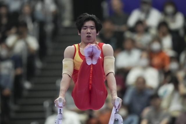 (260921) -- NAGOYA, Sept. 21, 2026 (Xinhua) -- Zhang Boheng of China competes on the parallel bars of the men's all-around final of Artistic Gymnastics at the 20th Asian Games Aichi-Nagoya 2026 in Nagoya, Japan, Sept. 21, 2026. (Xinhua/Lui Siu Wai)