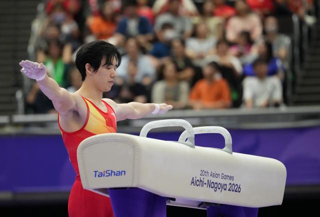 (260921) -- NAGOYA, Sept. 21, 2026 (Xinhua) -- Zhang Boheng of China prepares for the pommel horse competition of the men's all-around final of Artistic Gymnastics at the 20th Asian Games Aichi-Nagoya 2026 in Nagoya, Japan, Sept. 21, 2026. (Xinhua/Lui Siu Wai)