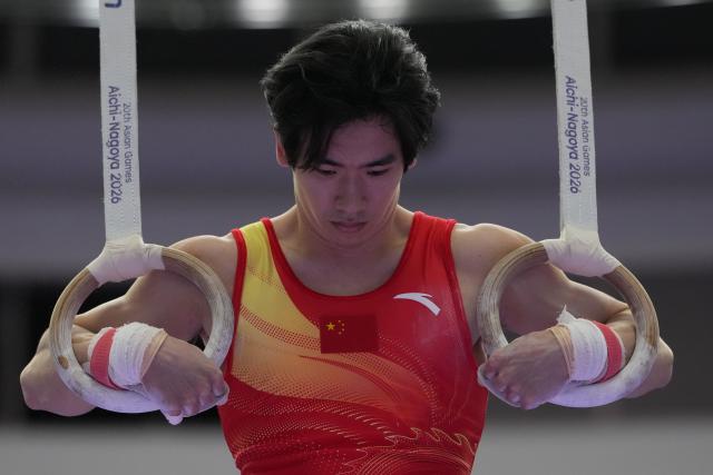 (260921) -- NAGOYA, Sept. 21, 2026 (Xinhua) -- Zhang Boheng of China competes in the rings of the men's all-around final of Artistic Gymnastics at the 20th Asian Games Aichi-Nagoya 2026 in Nagoya, Japan, Sept. 21, 2026. (Xinhua/Lui Siu Wai)