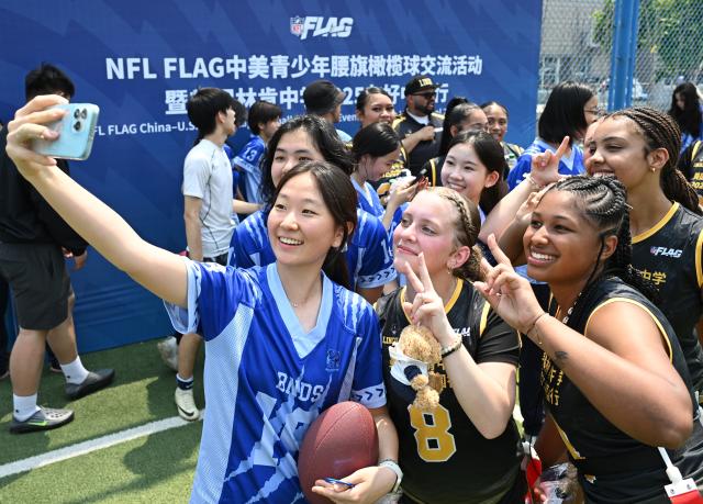 (260921) -- BEIJING, Sept. 21, 2026 (Xinhua) -- Students of Lincoln High School of the U.S. state of Washington and Beijing National Day School take selfies during the NFL FLAG China-U.S. Youth Flag Football Exchange Event & Lincoln High School 2025 China Tour in Beijing, capital of China, May 26, 2025. The hope of the China-U.S. relationship lies in the people, its foundation is in the societies, its future depends on the youth, and its vitality comes from exchanges at subnational levels.
   In recent years, the two countries have been strengthening people-to-people ties through cultural exchanges to inject sustained positive momentum into China-U.S relations. (Xinhua/Li He)