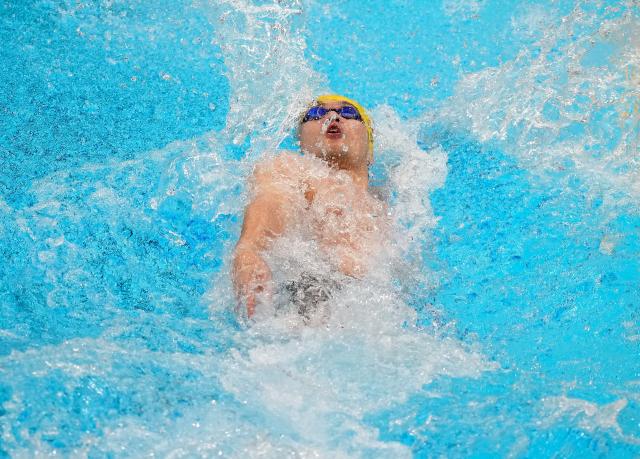 (260921) -- TOKYO, Sept. 21, 2026 (Xinhua) -- Xu Jiayu of China competes during the men's 50m backstroke final at the 20th Asian Games Aichi-Nagoya 2026 in Tokyo, Japan, Sept. 21, 2026. (Photo by Wang Shen/Xinhua)
