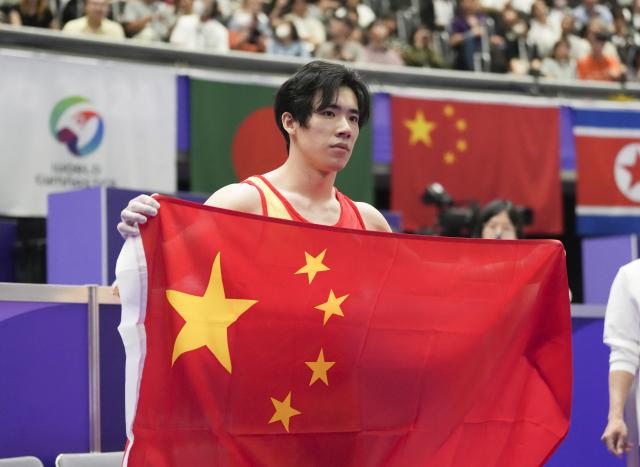 (260921) -- NAGOYA, Sept. 21, 2026 (Xinhua) -- Zhang Boheng of China celebrates after the men's all-around final of Artistic Gymnastics at the 20th Asian Games Aichi-Nagoya 2026 in Nagoya, Japan, Sept. 21, 2026. (Xinhua/Jia Yuchen)