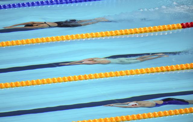 (260921) -- TOKYO, Sept. 21, 2026 (Xinhua) -- Haughey Siobhan (bottom) of Hong Kong of China and Li Jiaping (C) of China competes during the women's 200m freestyle final at the 20th Asian Games Aichi-Nagoya 2026 in Tokyo, Japan, Sept. 21, 2026. (Photo by Wang Shen/Xinhua)