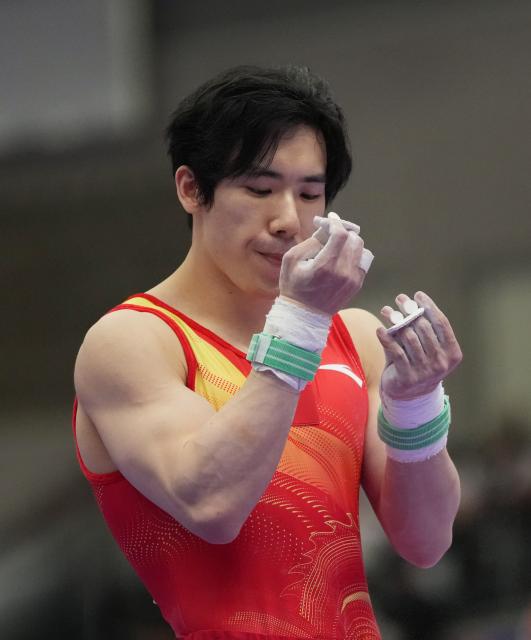 (260921) -- NAGOYA, Sept. 21, 2026 (Xinhua) -- Zhang Boheng of China prepares for the horizontal bar of the men's all-around final of Artistic Gymnastics at the 20th Asian Games Aichi-Nagoya 2026 in Nagoya, Japan, Sept. 21, 2026. (Xinhua/Jia Yuchen)
