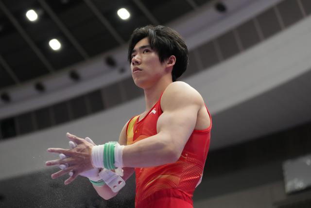 (260921) -- NAGOYA, Sept. 21, 2026 (Xinhua) -- Zhang Boheng of China prepares for the horizontal bar of the men's all-around final of Artistic Gymnastics at the 20th Asian Games Aichi-Nagoya 2026 in Nagoya, Japan, Sept. 21, 2026. (Xinhua/Jia Yuchen)
